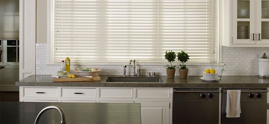 Kitchen faux wood blinds.